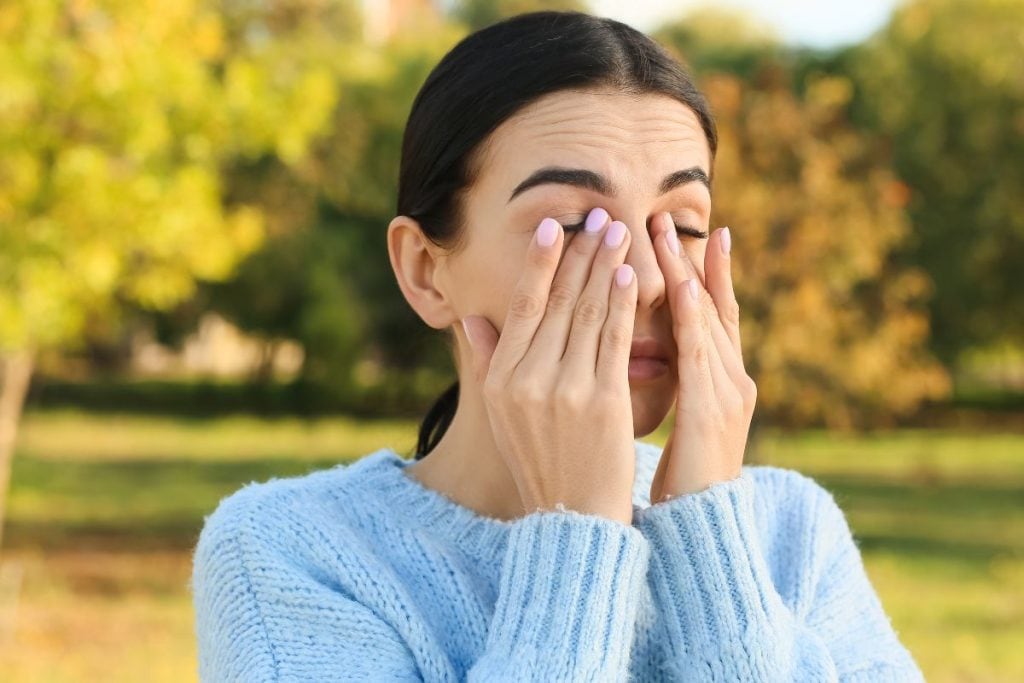 young-woman-suffering-from-allergy-outdoors